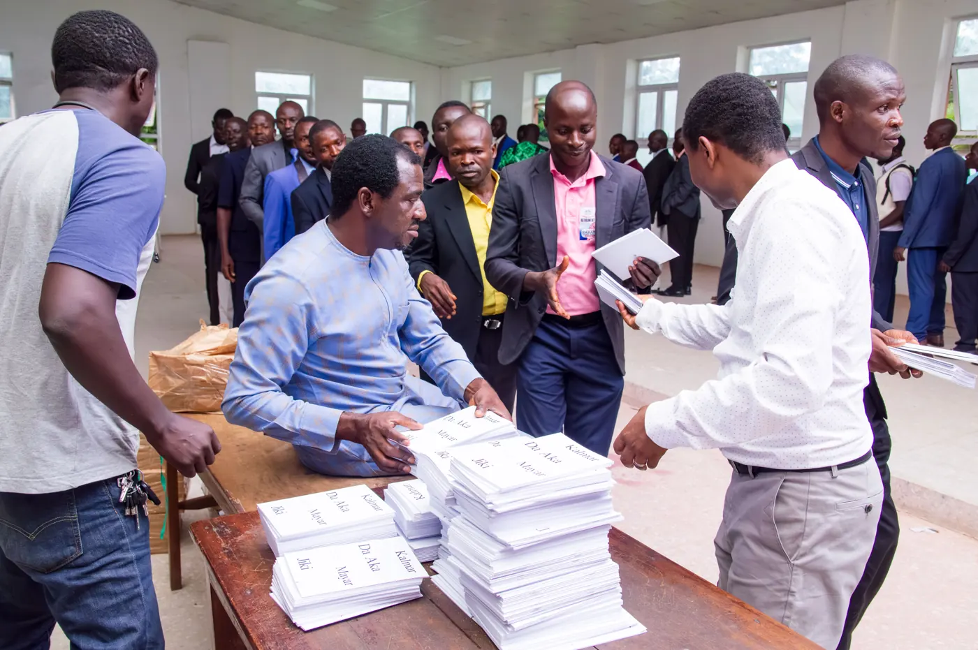 Books being handed to participants in Gindiri, July 2025